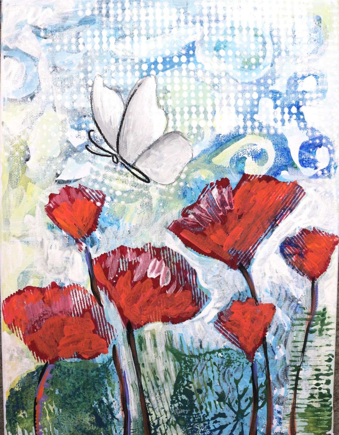 Stylistic mixed media collage image of a butterfly floating above flowers