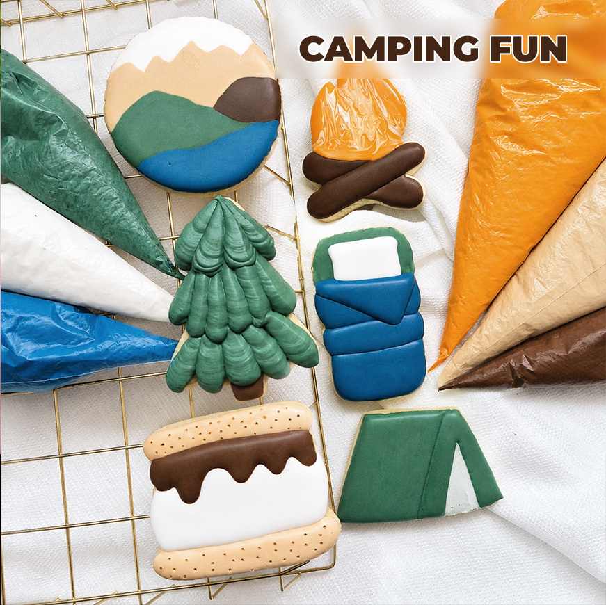 Camping themed cookies on a table