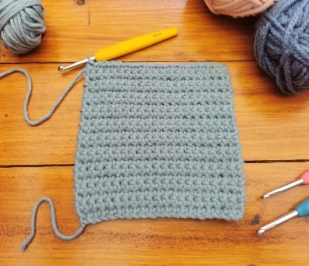 A square crochet on a table
