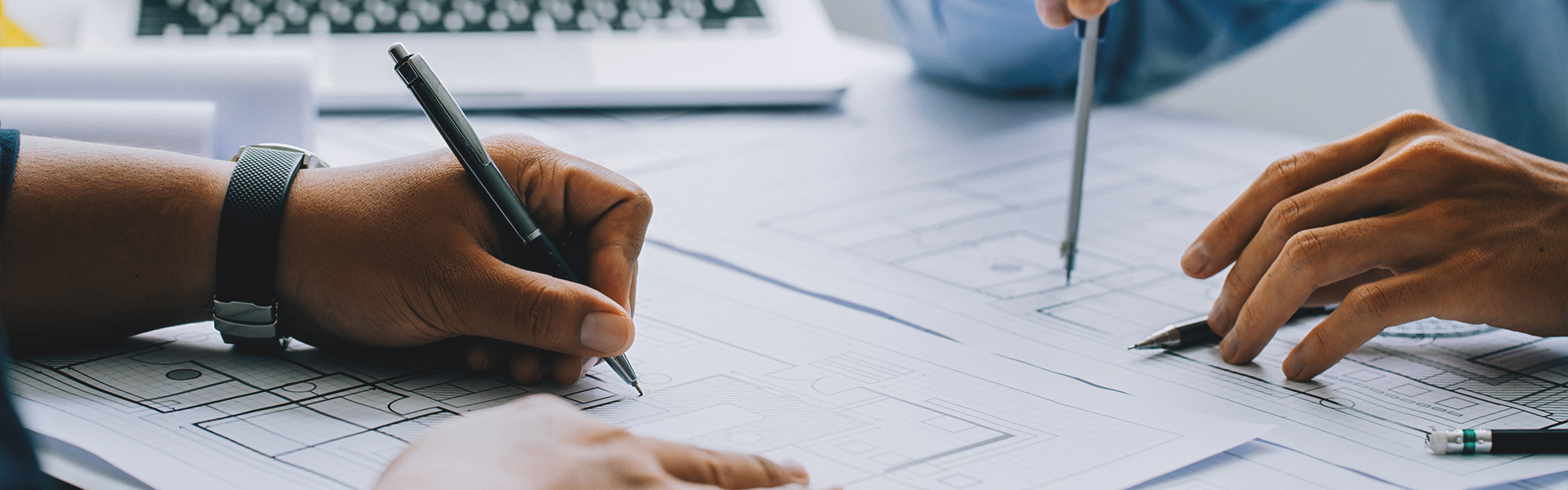 People working on drafting paper