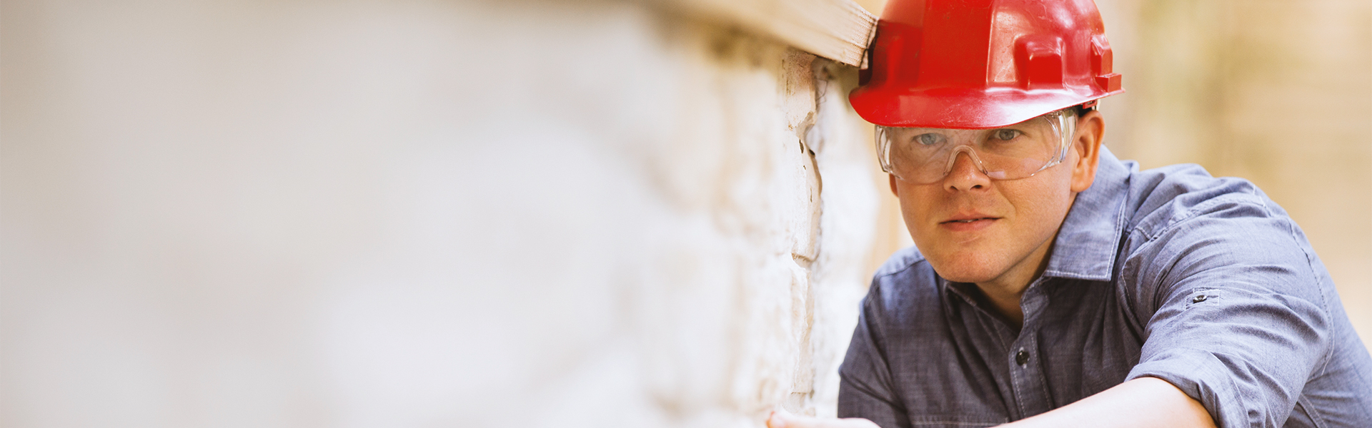 An inspector looking at work done on the exterior of a house