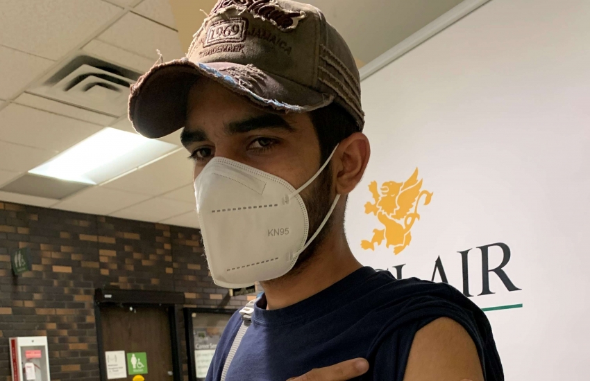Computer Networking student Sahil Kalyan was the first person to receive the COVID-19 vaccine at the campus Health Centre Wednesday.