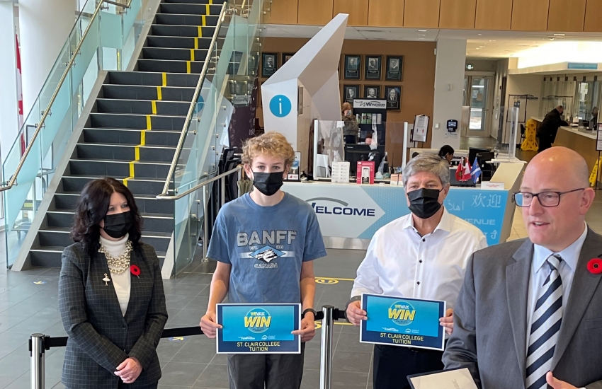 Windsor Mayor Drew Dilkens, St. Clair College President Patti France and Vice President College Communications & Community Relations John Fairley were at Windsor City Hall to greet winners of the WE Vax To Win contest.