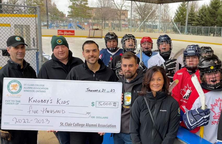 Cheque presentation at hockey rink
