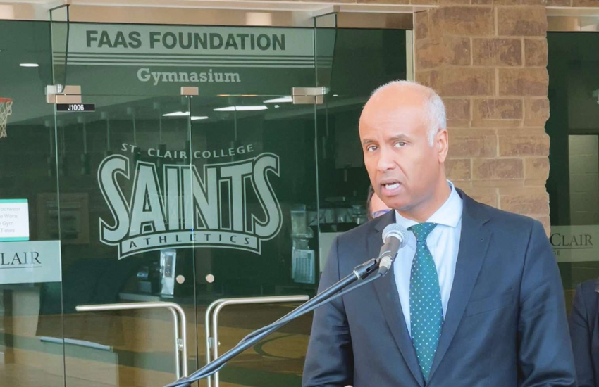 Honourable Minister Ahmad Hussen Minister of International Development speaking at the podium