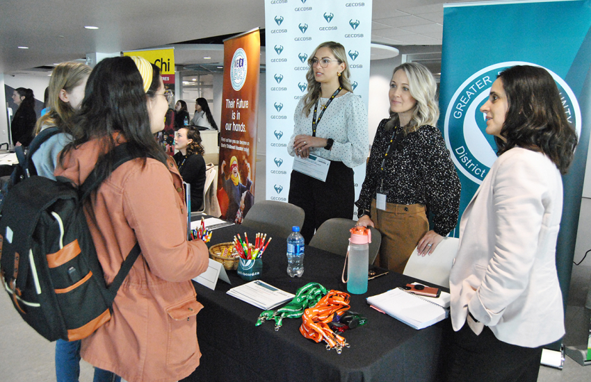 Students speaking with potential employers