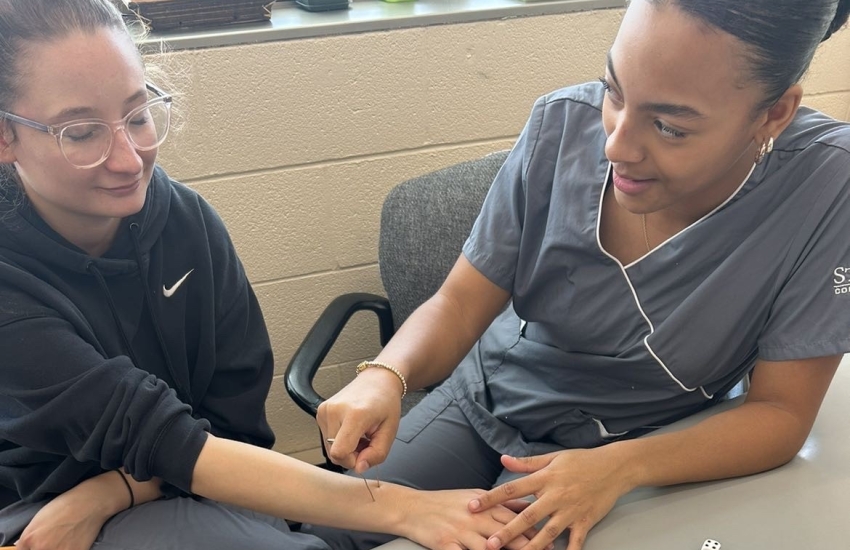 Mya with fellow student