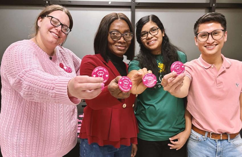 Volunteers selling Pink Shirt Day buttons