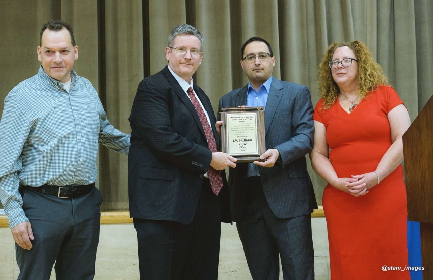 Dr. William Tape receiving the Engineer of the Year Award