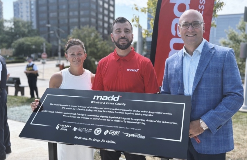 Lori Kempe, Chaouki Hamka and Joe D'Angela stand at the new MADD memorial garden