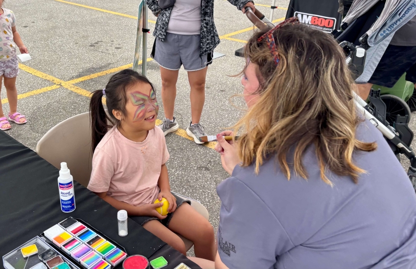 A young girl gets her face painted at the Alumni Association’s Family Fun Day at Main Windsor Campus on Sept. 13, 2025.
