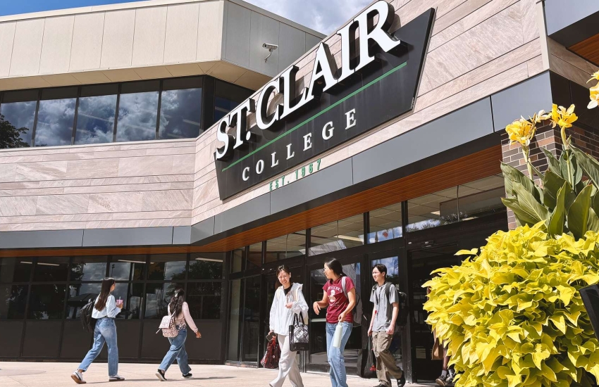 Students walk in and out at the front entrance at St. Clair College's Main Windsor Campu