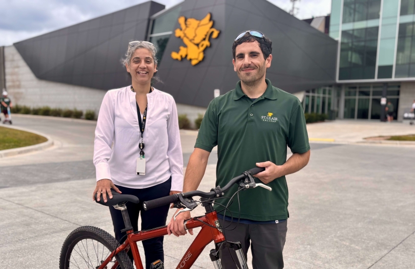 Dr. Karamjeet K. Dhillon and Kevin Roy stand out front of St. Clair College's Main Windsor Campus on Aug. 28, 2025.