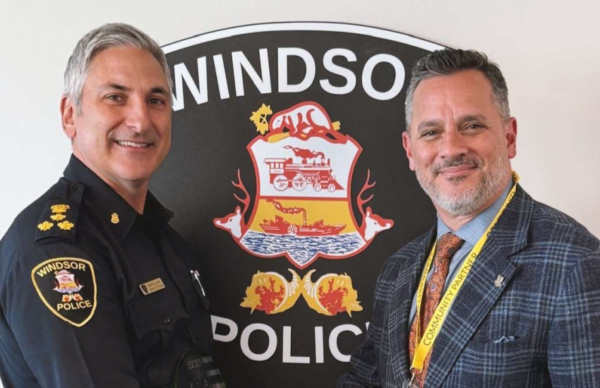Windsor Police Chief Jason Bellaire stands with St. Clair College President Michael Silvaggi