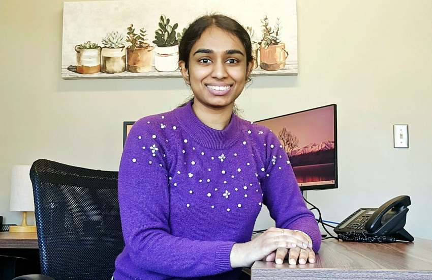 Arya Krishna sitting at her desk at the County of Renfrew in March of 2026. 
