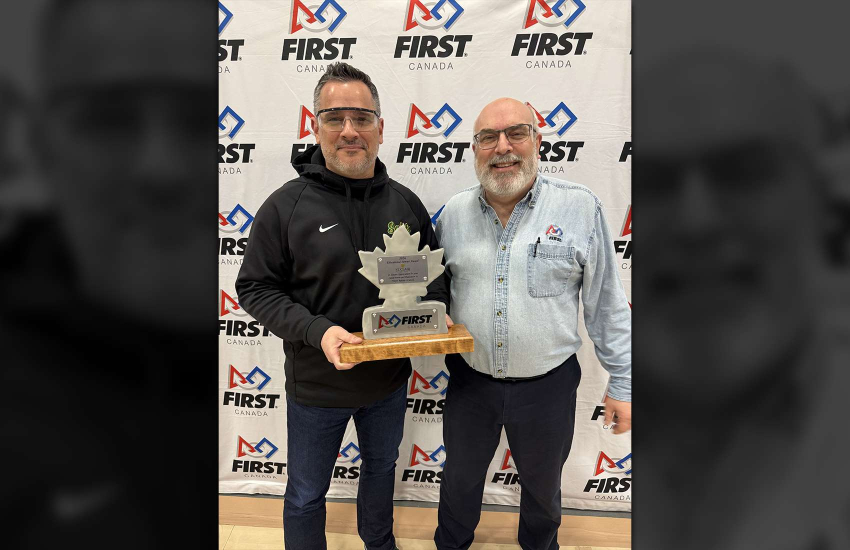 St. Clair College President Michael Silvaggi holding the FIRST Robotics Canada Education Partner Excellence Award with Larry Koscielski of Windsor-Essex FIRST Robotics 