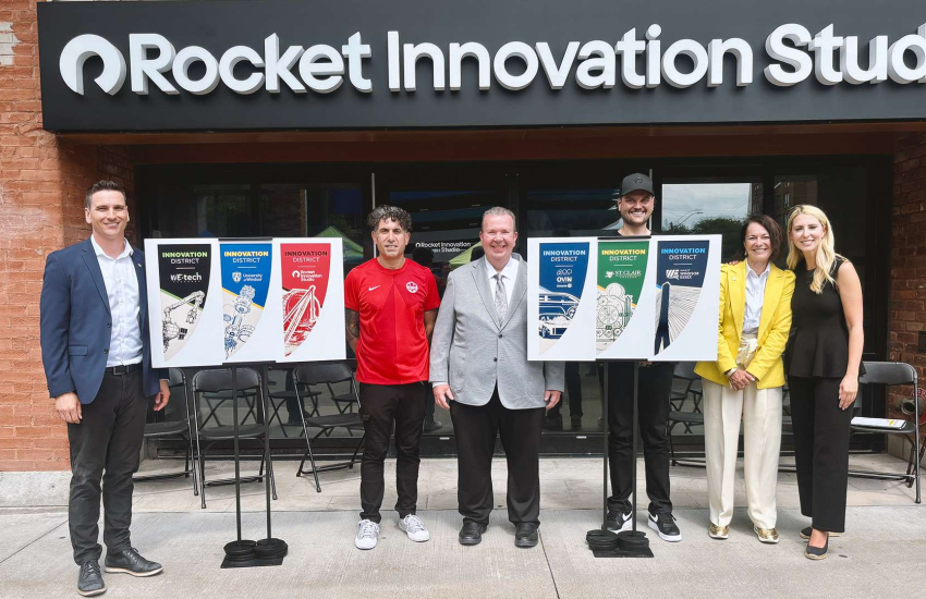 Partners from the University of Windsor, City of Windsor, Invest WindsorEssex, Rocket Innovation Studio, St. Clair College and WEtech Alliance unveil the banners in the Innovation District