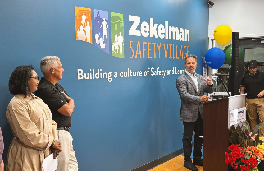Barry Zekelman of the Stephanie and Barry Zekelman Foundation speaks to a crowd at the newly renamed Zekelman Safety Village during a launch party