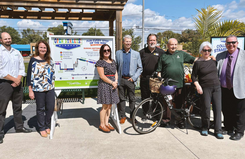Sponsors and City of Windsor representatives gather to kick off Open Streets 2026 at the Farrow Riverside Miracle Park