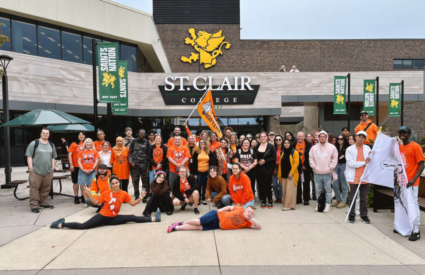 Students, faculty and staff pose at St. Clair College's Windsor Main Campus