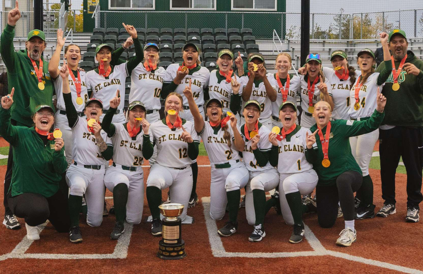 The St. Clair Saints Women's Softball team celebrates a gold medal