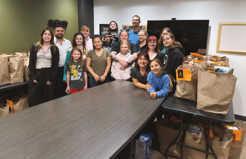 Members of TSI are joined by volunteers for the annual Trick or Eat Food Drive