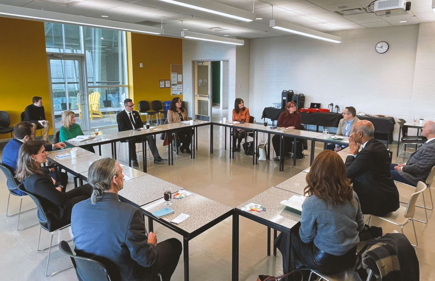 Group of people around a meeting table
