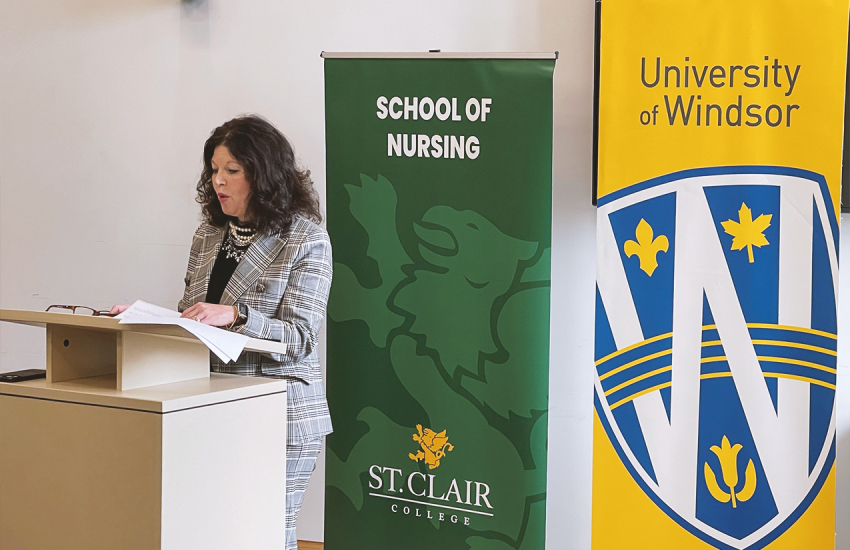 SCC President Patti France speaking at a podium