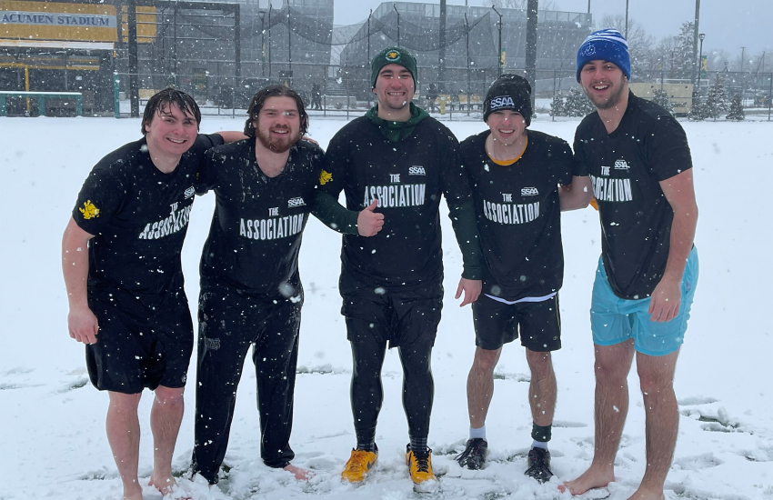 5 students standing in snow
