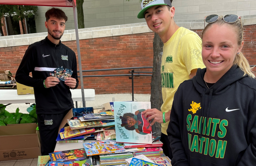 Students with books on table