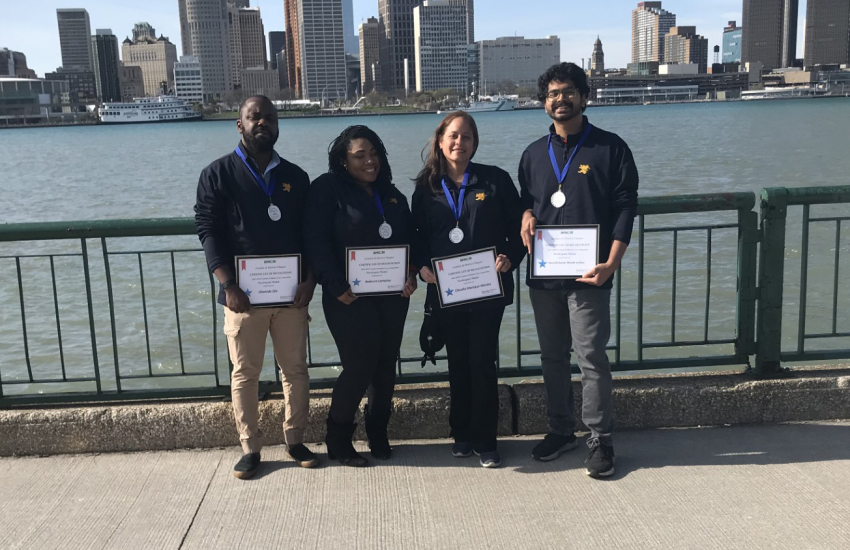 Fifth place team in front of Detroit river