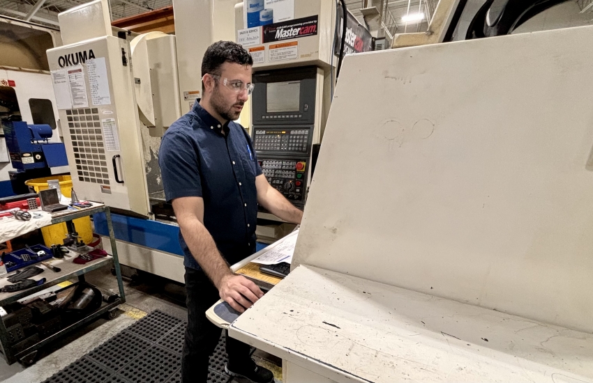 Eddy working on a CNC machine