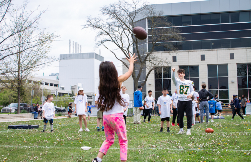 Young girl receiving pass from #87