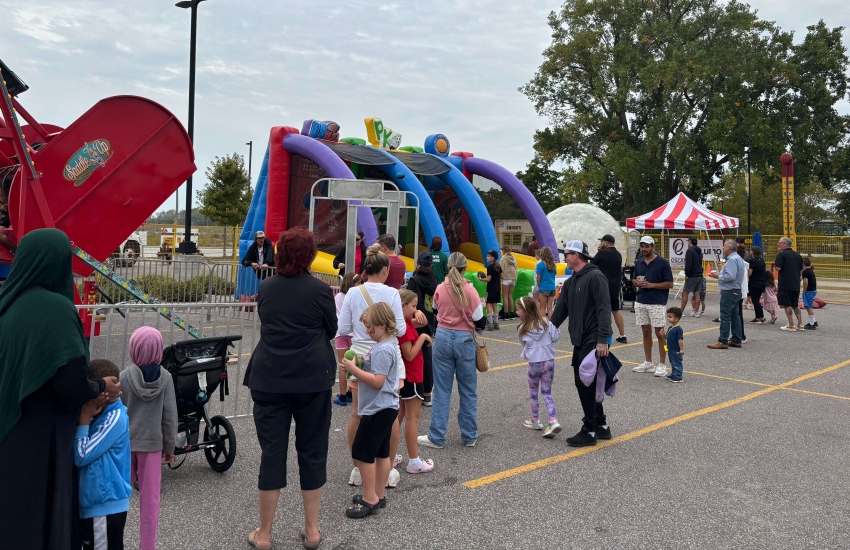 Families wait in line to visit attractions at the Alumni Association’s Family Fun Day at Main Windsor Campus on Sept. 13, 2025. 
