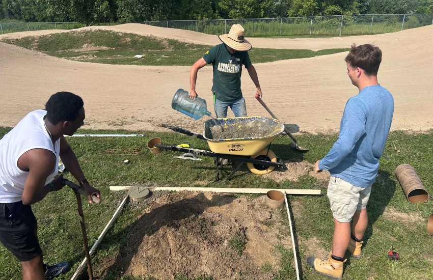 St. Clair College Students prepare the foundation for a new announcing tower pavilion at Wolfe Creek BMX Racetrack in Chatham.