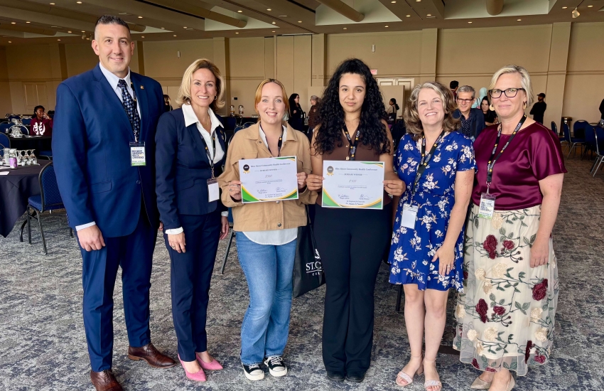 Conference co-chairs pose with Amanda-Lee St. Pierre and Alexcia Rizza at the 2025 Rise Above Community Health Conference on Sept. 26, 2025. 