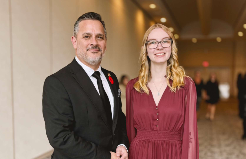 St. Clair College President Michael Silvaggi stands with Sarah Wilkins, the recipient of the Dr. Patti France Athena Scholarshi
