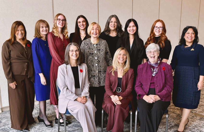The Athena Scholarship committee stands with the four scholarship recipients at the 26th annual Athena Luncheon