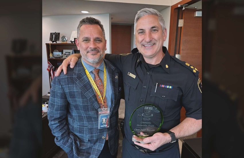 St. Clair College President Michael Silvaggi and Windsor Police Chief Jason Bellaire holding his Community Partnership Award