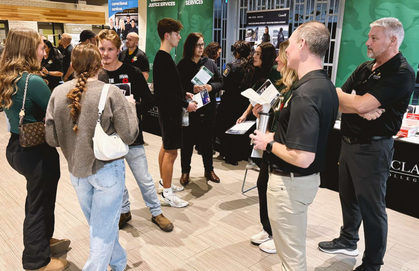 Professors speak with students during the Fall 2025 Open House