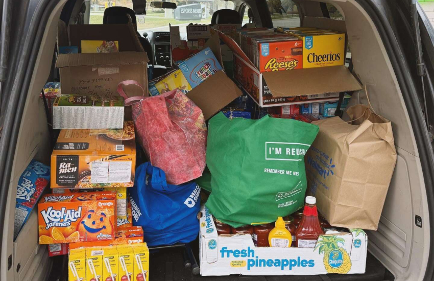 A trunk loaded with food items collected
