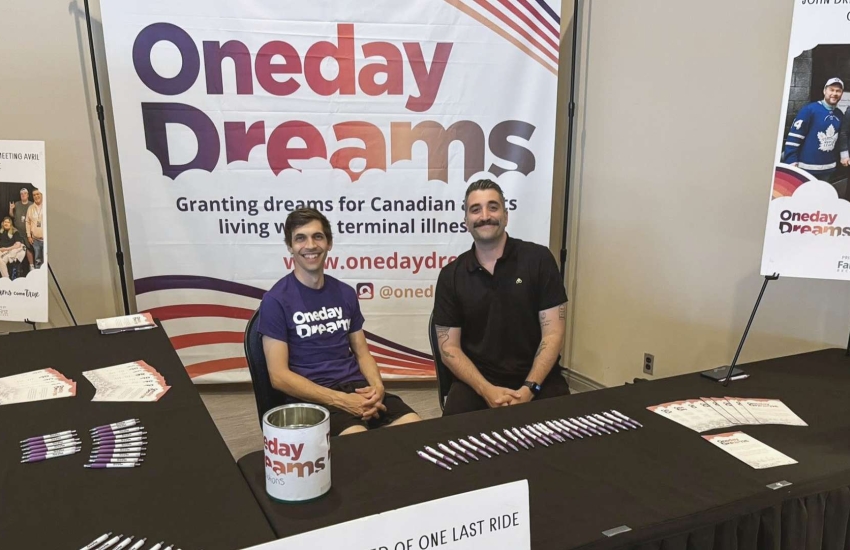 Jason Soulliere and Michael Bennett, co-founders of Oneday Dreams, sitting behind a table