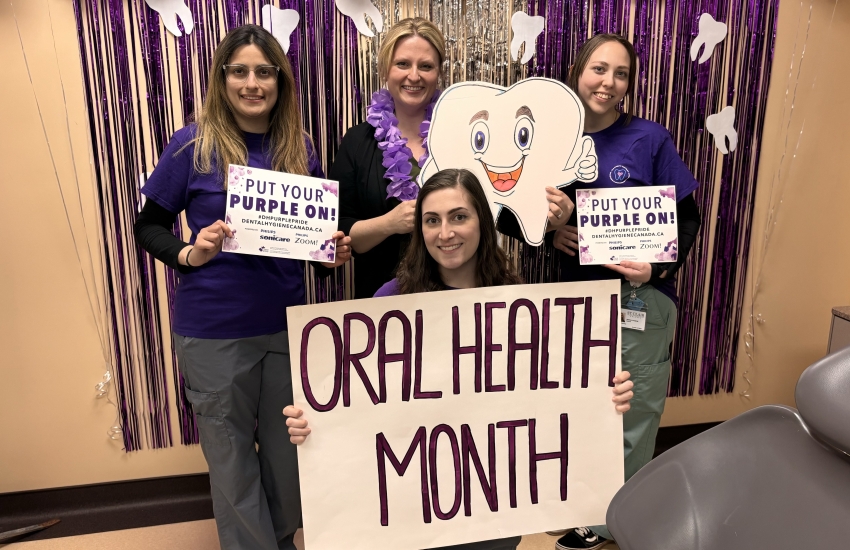 Dental Hygiene students holding signs