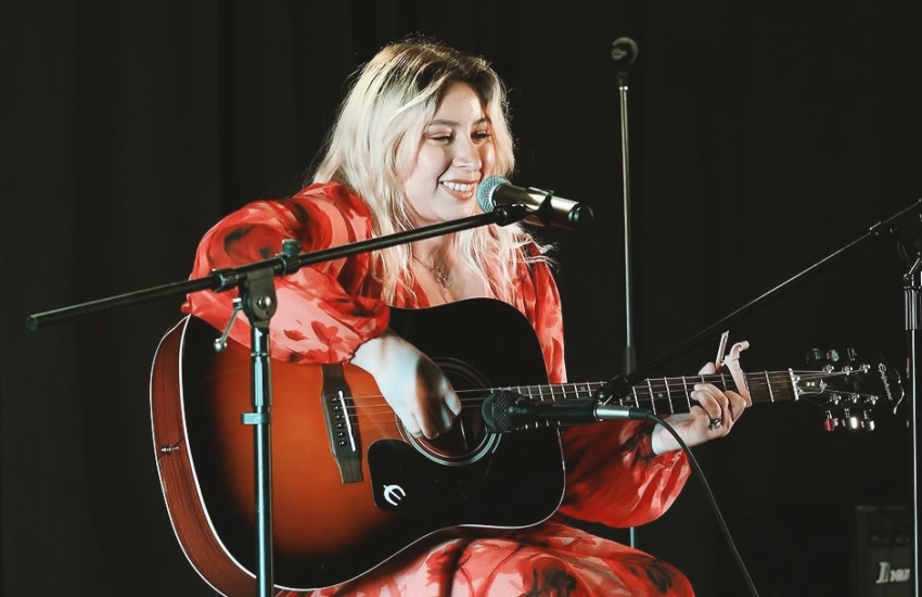 Second-year St. Clair College Journalism student Paula Bunay performing on stage