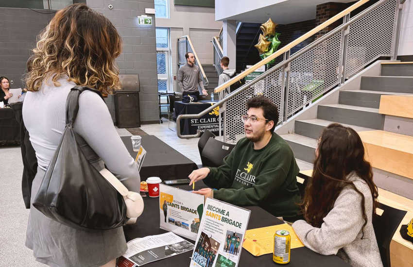 Students visting job fair table.