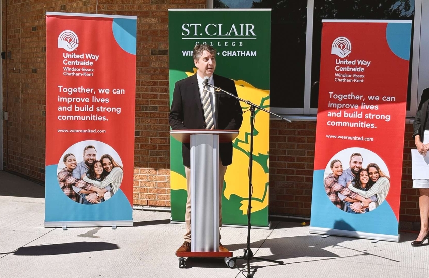 Art speaking at podium