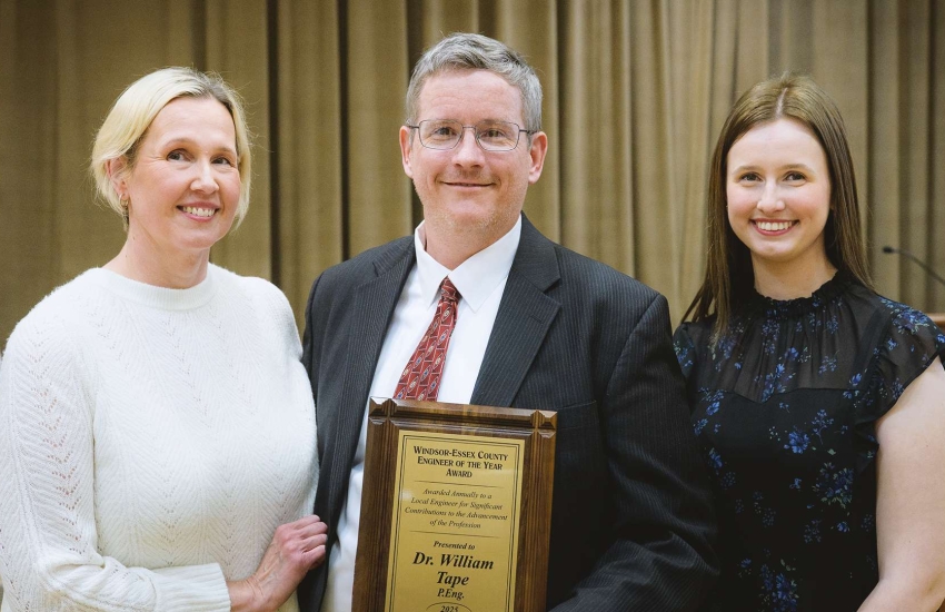 Dr. William Tape poses with his family