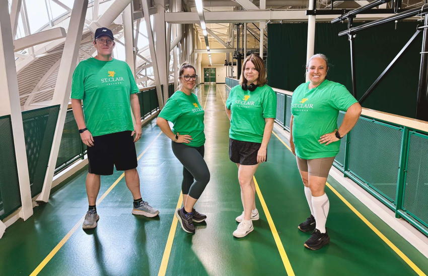 Andrew Campbell, Lauren Amlin, Wintre McConnell and Andrea Fryer, all members of the Saints on the Run club, pose