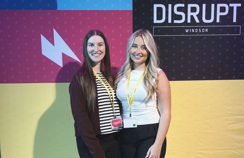 Brook Hillier, right, poses at the DisruptHR Windsor conference
