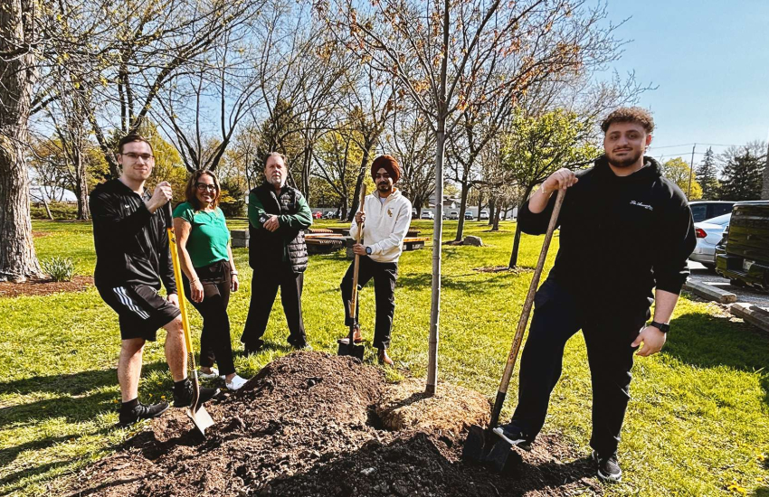 SRC, SSAA, YQG Green and St. Clair College representatives plant a tree on Earth Day at Main Windsor Campus
